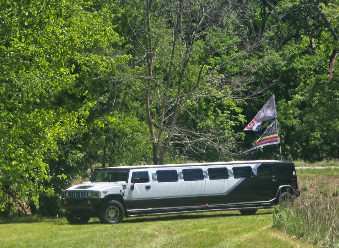 Hummer limo with American flags
